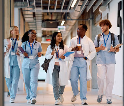 group of health students walking together and smiling